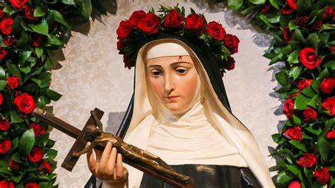 Santa Rita con rosa e neve