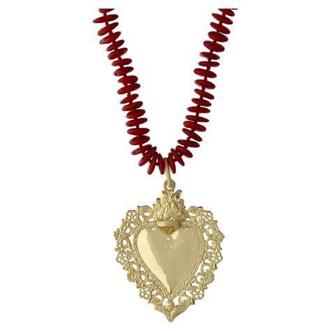 Simbolo cuore sacro gioiello dorato