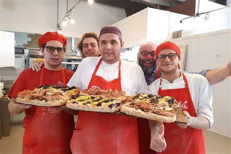 pizzeria inclusiva ragazzi autistici preparano pizze